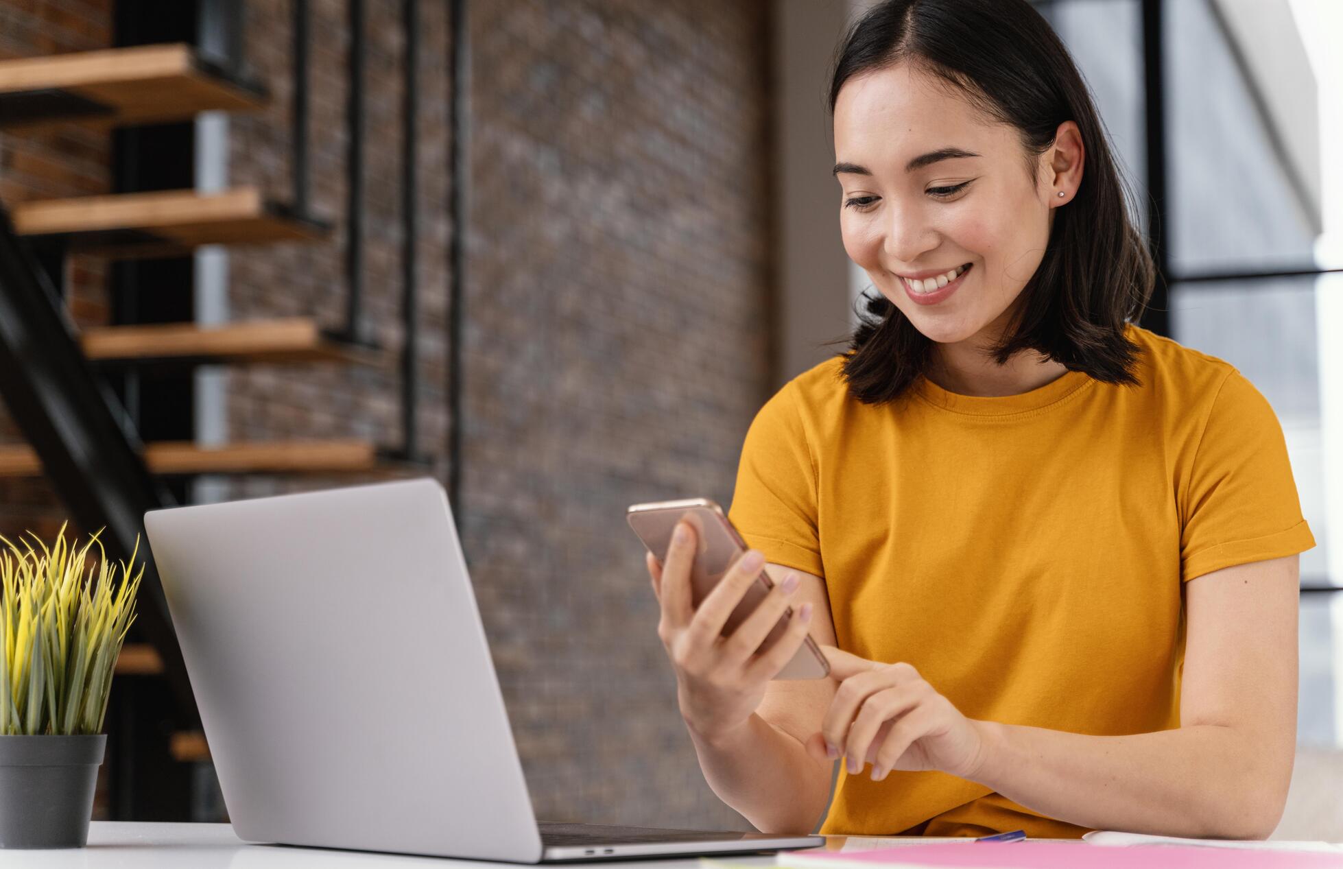 young-woman-using-phone-while-attending-online-class (1).jpg