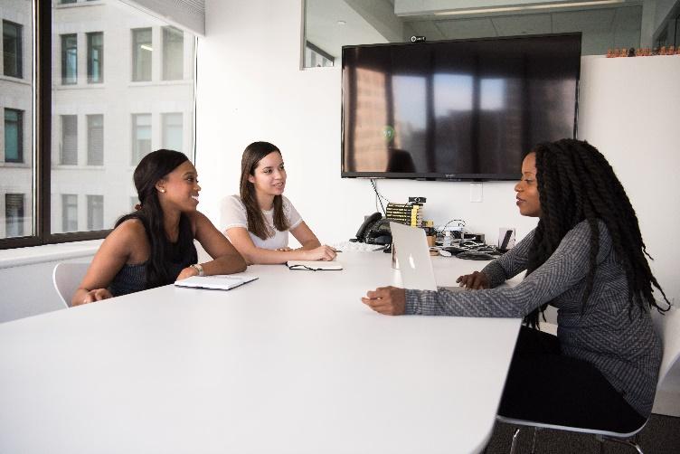 A group of women sitting at a table
Description automatically generated with medium confidence